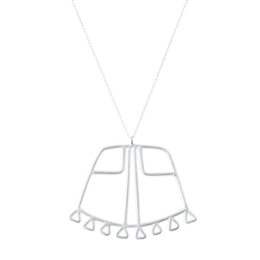 Close up of Sky Phaebl sterling silver curved trapezoid pendant lined with fixed triangular fringe along the base, featuring linear filigree inner detail. Pendant hangs on delicate silver chain. 